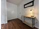 Simple entryway with wooden floors, minimalist decor, and a bright lamp at 129 Sturbridge Dr # 15, Clayton, NC 27520
