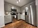 Modern kitchen with stainless steel appliances, light gray cabinetry, and ample counter space at 129 Sturbridge Dr # 15, Clayton, NC 27520