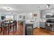 Modern kitchen features stainless steel appliances and open dining area with hardwood style floors at 129 Sturbridge Dr # 15, Clayton, NC 27520