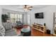 Comfortable living room with hardwood floors, plush armchair, and plenty of natural light at 129 Sturbridge Dr # 15, Clayton, NC 27520