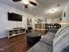 Living room with hardwood floors and bar-style seating area at 129 Sturbridge Dr # 15, Clayton, NC 27520