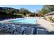 Community pool surrounded by lounge chairs for residents' enjoyment at 129 Sturbridge Dr # 15, Clayton, NC 27520