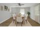 Bright dining room featuring a modern light fixture, window and a wooden dining table with seating for six at 1601 Little Falls Dr, Rocky Mount, NC 27801