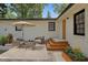 Outdoor patio with seating area, patterned rug, potted plants, and exterior wooden steps at 1601 Little Falls Dr, Rocky Mount, NC 27801