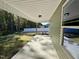 A covered back porch, offering views of the yard and providing a transition to outdoor spaces at 207 Earnest Way # 15, Kenly, NC 27542