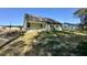 A sunny backyard view highlighting the home's exterior and outdoor space with green siding at 207 Earnest Way # 15, Kenly, NC 27542