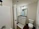 Bathroom featuring wood-look flooring, vanity with granite countertop, and glass door shower at 207 Earnest Way # 15, Kenly, NC 27542