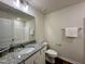 Bathroom featuring wood-look flooring, vanity with granite countertop, and glass door shower at 207 Earnest Way # 15, Kenly, NC 27542
