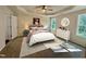 Tranquil main bedroom with soft lighting, a tray ceiling, neutral walls, and carpet flooring at 207 Earnest Way # 15, Kenly, NC 27542
