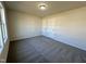 Bedroom with neutral paint, carpeted floor and double door closet at 207 Earnest Way # 15, Kenly, NC 27542