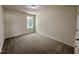 Bright bedroom with neutral walls, carpet, and a window providing ample natural light at 207 Earnest Way # 15, Kenly, NC 27542