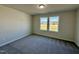 Bedroom with neutral paint, double window for natural light and plush carpeting at 207 Earnest Way # 15, Kenly, NC 27542
