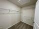 Walk-in closet with wire shelving and neutral walls over plush carpeted flooring at 207 Earnest Way # 15, Kenly, NC 27542