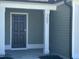 Close-up of a home's entryway highlighting the dark front door and house number at 207 Earnest Way # 15, Kenly, NC 27542