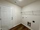 Neutral laundry room with storage shelves and washer/dryer hookups at 207 Earnest Way # 15, Kenly, NC 27542