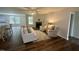 Bright living room with a fireplace, ceiling fan, hardwood floors, neutral paint, and comfortable seating arrangement at 207 Earnest Way # 15, Kenly, NC 27542