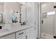 Bright bathroom featuring modern vanity sink and a glass door shower at 2401 E Main St, Durham, NC 27703