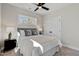 Cozy bedroom featuring soft carpet, a ceiling fan, and closet at 2401 E Main St, Durham, NC 27703