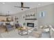Bright living room with modern fireplace, plenty of seating and open to kitchen at 2401 E Main St, Durham, NC 27703
