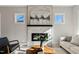 Bright living room with a fireplace, modern furniture, and plenty of natural light at 2401 E Main St, Durham, NC 27703