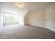 Large carpeted room featuring a window and a door at 138 Abingdon Farms Dr, Selma, NC 27576