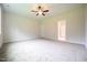 Spacious bedroom with neutral carpet and a ceiling fan at 138 Abingdon Farms Dr, Selma, NC 27576