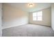 Carpeted bedroom with a large window providing natural light at 138 Abingdon Farms Dr, Selma, NC 27576