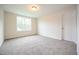 Carpeted room bathed in natural light with a big window at 138 Abingdon Farms Dr, Selma, NC 27576