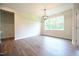 Bright, open dining room with a modern chandelier and plenty of natural light at 138 Abingdon Farms Dr, Selma, NC 27576