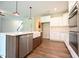 Modern kitchen with center island, stainless steel appliances, and hardwood floors at 138 Abingdon Farms Dr, Selma, NC 27576