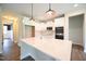 Bright, open kitchen with a large center island and modern appliances at 138 Abingdon Farms Dr, Selma, NC 27576