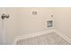 Laundry room with decorative patterned tile floor at 138 Abingdon Farms Dr, Selma, NC 27576