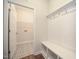 Mud room with coat hooks, bench, and decorative patterned tile floor at 138 Abingdon Farms Dr, Selma, NC 27576