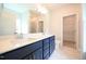 Bathroom featuring double sink vanity, white countertops, and ceramic tile flooring at 236 Abingdon Farms Dr, Selma, NC 27576