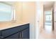Bathroom featuring a blue vanity with stone countertop and tile floors at 236 Abingdon Farms Dr, Selma, NC 27576