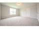 Empty bedroom with two large windows and a closet at 236 Abingdon Farms Dr, Selma, NC 27576