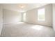 Neutral tone bedroom with two large windows at 236 Abingdon Farms Dr, Selma, NC 27576