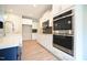 Modern kitchen showcasing stainless steel double oven, microwave, and a spacious center island at 236 Abingdon Farms Dr, Selma, NC 27576
