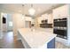 Stylish kitchen featuring a center island, stainless steel appliances, and elegant pendant lighting at 236 Abingdon Farms Dr, Selma, NC 27576