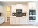 Well-equipped kitchen with stainless steel appliances, ample cabinet space, and modern design at 236 Abingdon Farms Dr, Selma, NC 27576