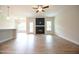 Comfortable living room with fireplace, ceiling fan, and lots of natural light from the door and windows at 236 Abingdon Farms Dr, Selma, NC 27576