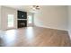 Well-lit living room featuring a modern fireplace and an abundance of space for furnishings at 236 Abingdon Farms Dr, Selma, NC 27576
