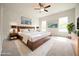 Bright main bedroom with accent wall, ceiling fan, and natural light at 236 Abingdon Farms Dr, Selma, NC 27576