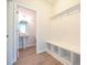 Mudroom with storage bench and coat hooks, leading to powder room at 236 Abingdon Farms Dr, Selma, NC 27576