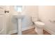 Powder room featuring pedestal sink and toilet at 236 Abingdon Farms Dr, Selma, NC 27576