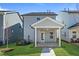 Backyard featuring covered patio and green grass with a view of the home at 733 Portland Rose Dr, Knightdale, NC 27545