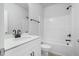 Bright bathroom featuring a vanity with quartz countertop and a shower-tub combo at 733 Portland Rose Dr, Knightdale, NC 27545