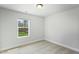Bright bedroom featuring neutral carpet and walls, natural light from one window at 733 Portland Rose Dr, Knightdale, NC 27545