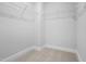 Walk-in closet with wire shelving and neutral carpet, offering ample storage space at 733 Portland Rose Dr, Knightdale, NC 27545
