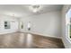 Bright, open-concept living room with wood floors and white walls at 733 Portland Rose Dr, Knightdale, NC 27545